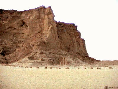 At the foot of Jebel Barkal stand the ruins of the Temple of Mut, its columns still rising from the sand where the Napatan kings once worshipped the mother goddess alongside Amun.